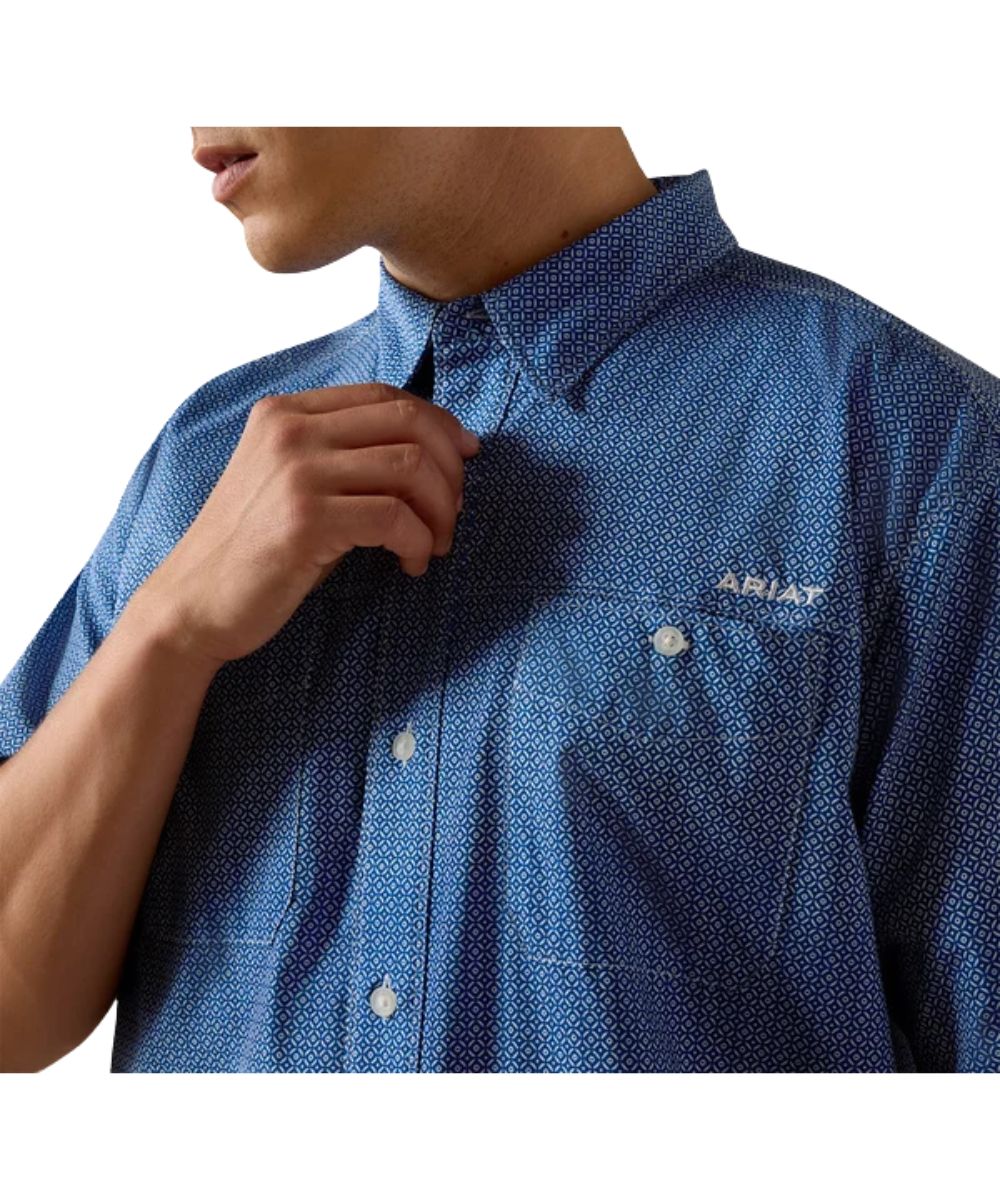 Close-up view of the goemetric print and button-through chest pockets