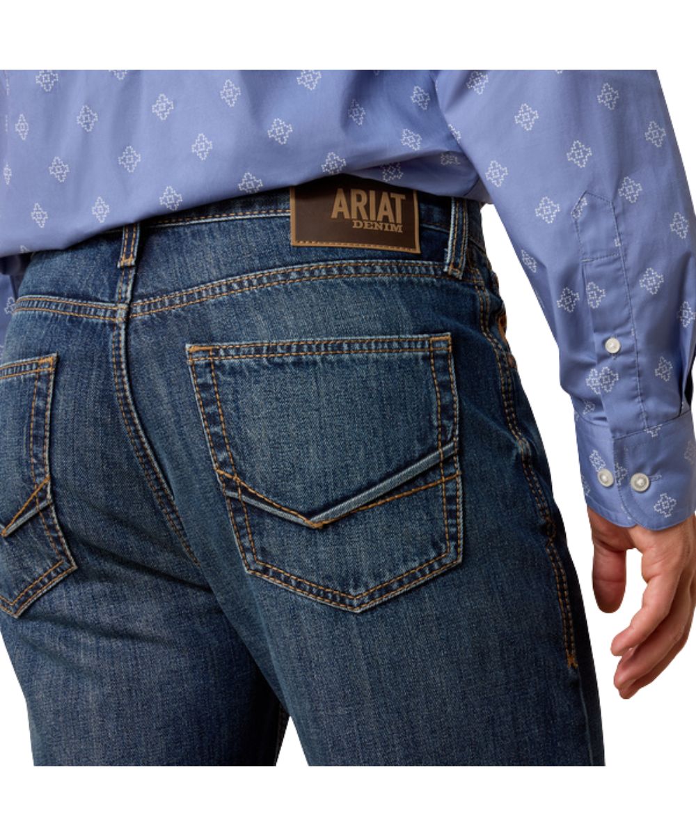 Close-Up View Of The Raised Denim Embroidery On The Back Pockets With Contrast Stitched Accents, This Jean Also Features Loop Lock For A Durable Back Belt Loop