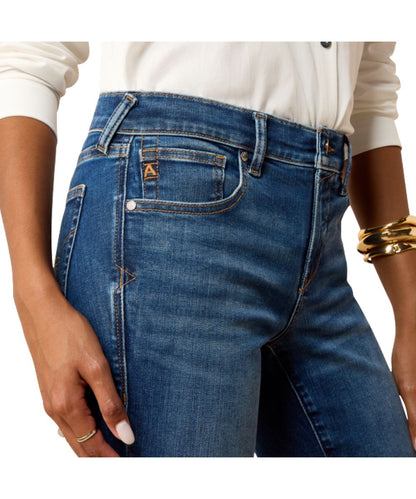 Close-up view of the front pocket featuring the perfect rise, medium wash, and contoured waistband