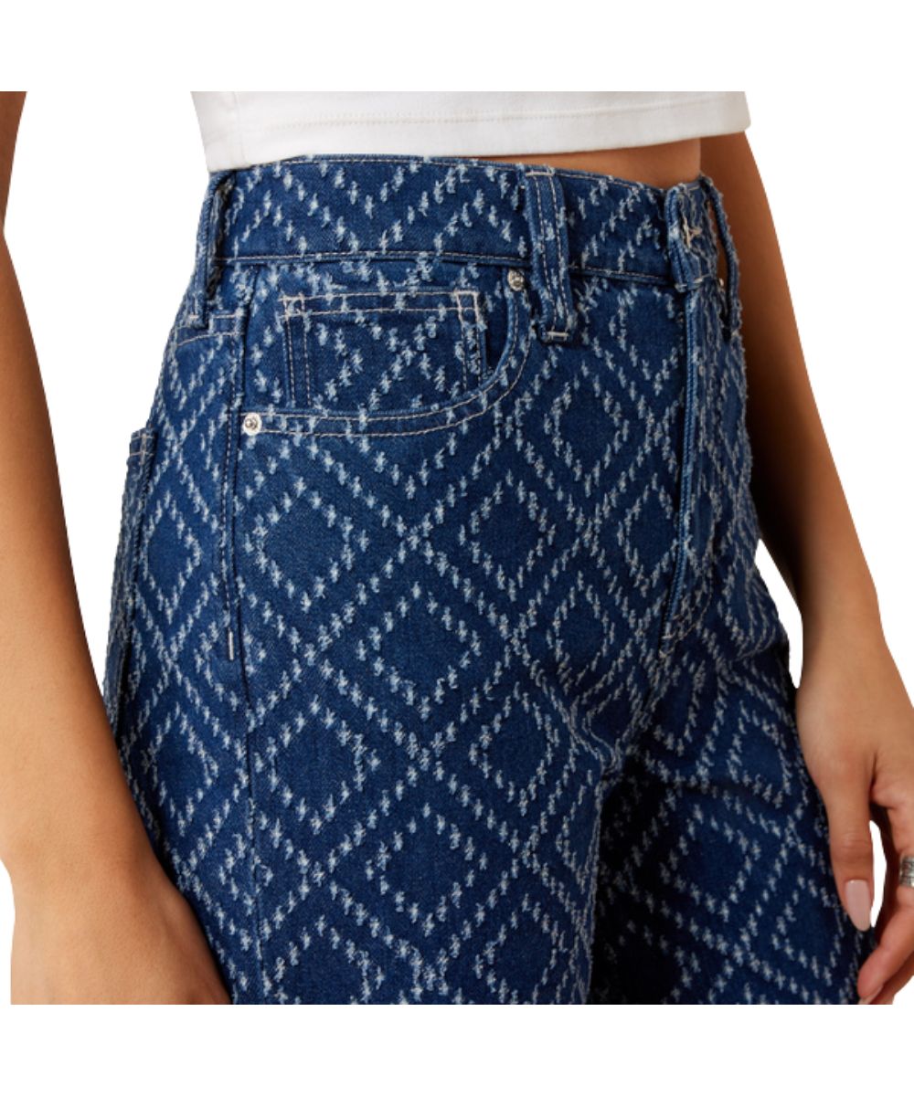 Close-up view of the front pockets featuring the contoured waistband, high rise, and textured needle-punch design