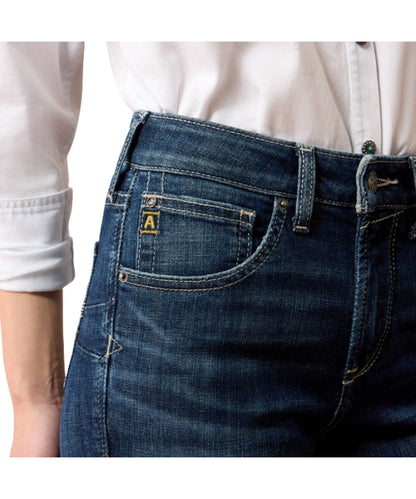Close-up view of the front pocket, contoured waist, and high rise