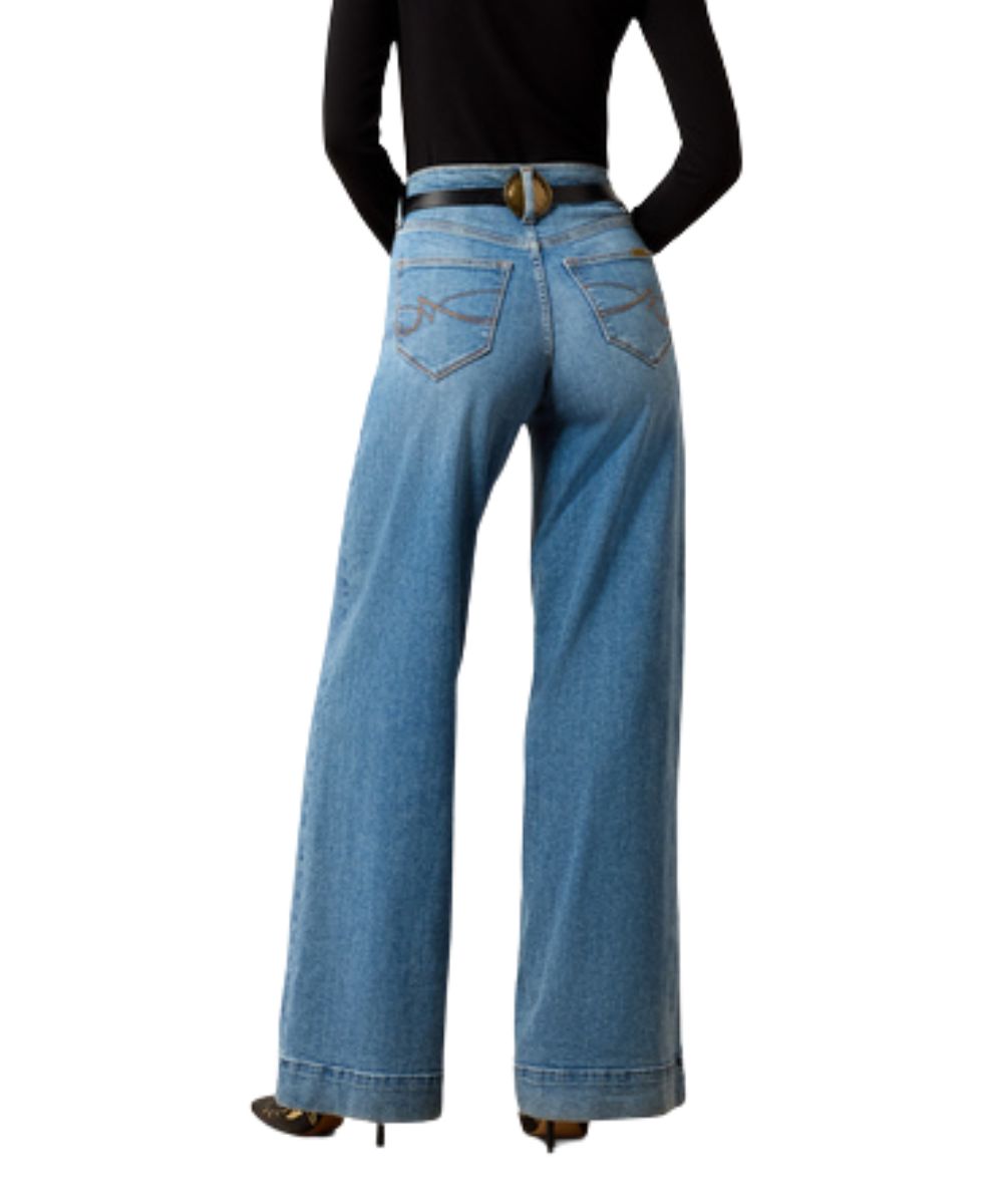 Back view of the women's wide leg jean in a light wash featuring the high rise, trouser hem, and ultra stretch