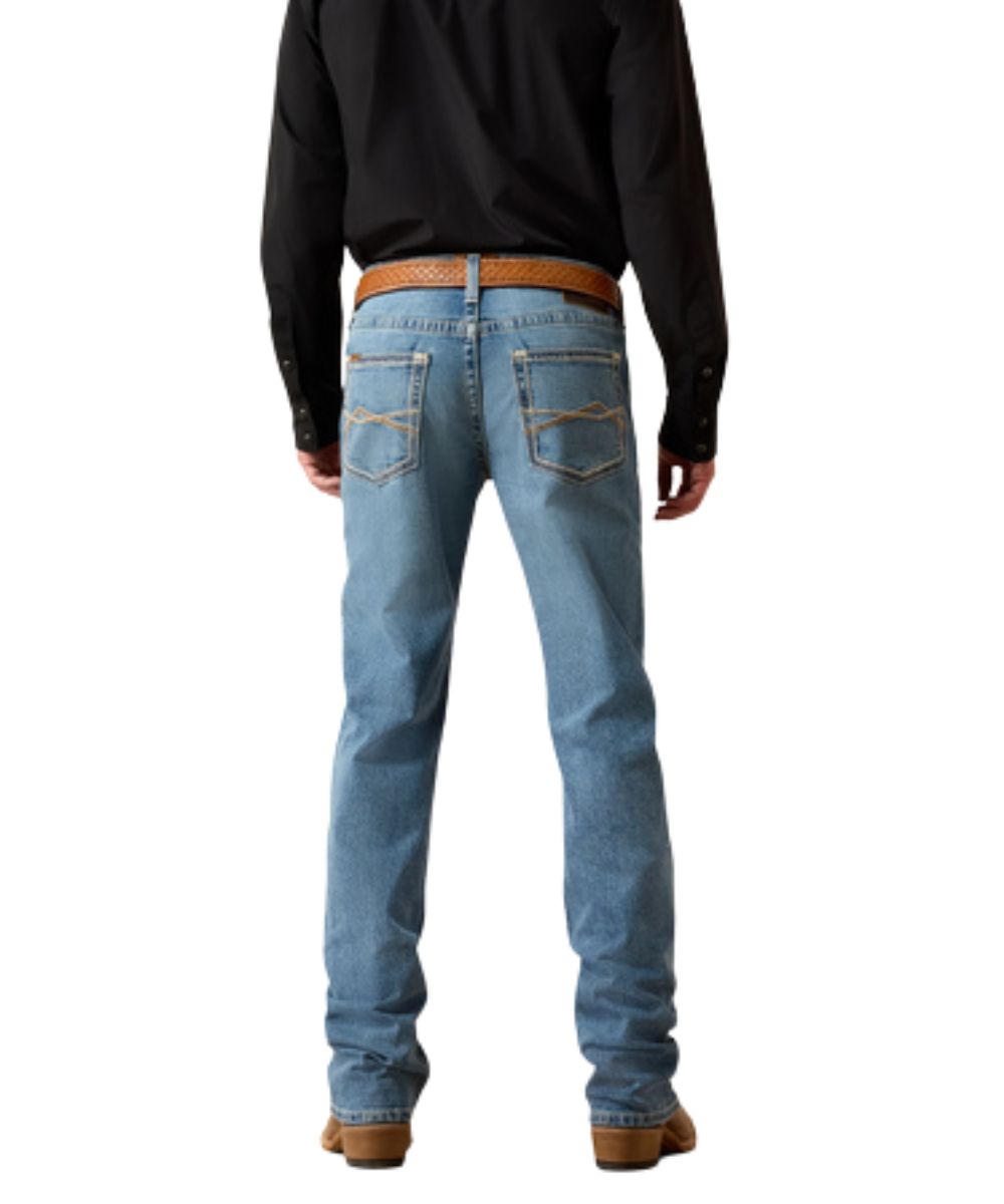 Back view of the men's medium wash straight jean featuring the mid rise and stretchable construction