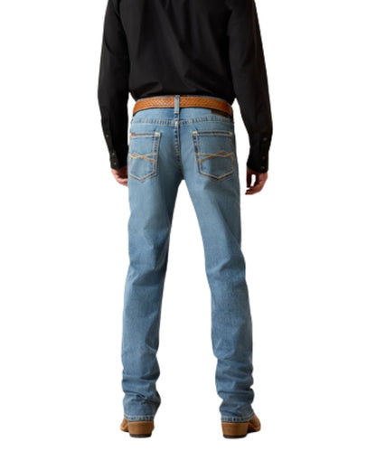 Back view of the men's medium wash straight jean featuring the mid rise and stretchable construction