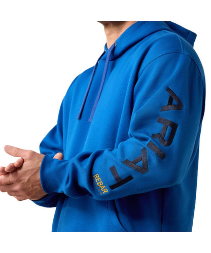 Close-up view of the navy logo embroidery at the left sleeve