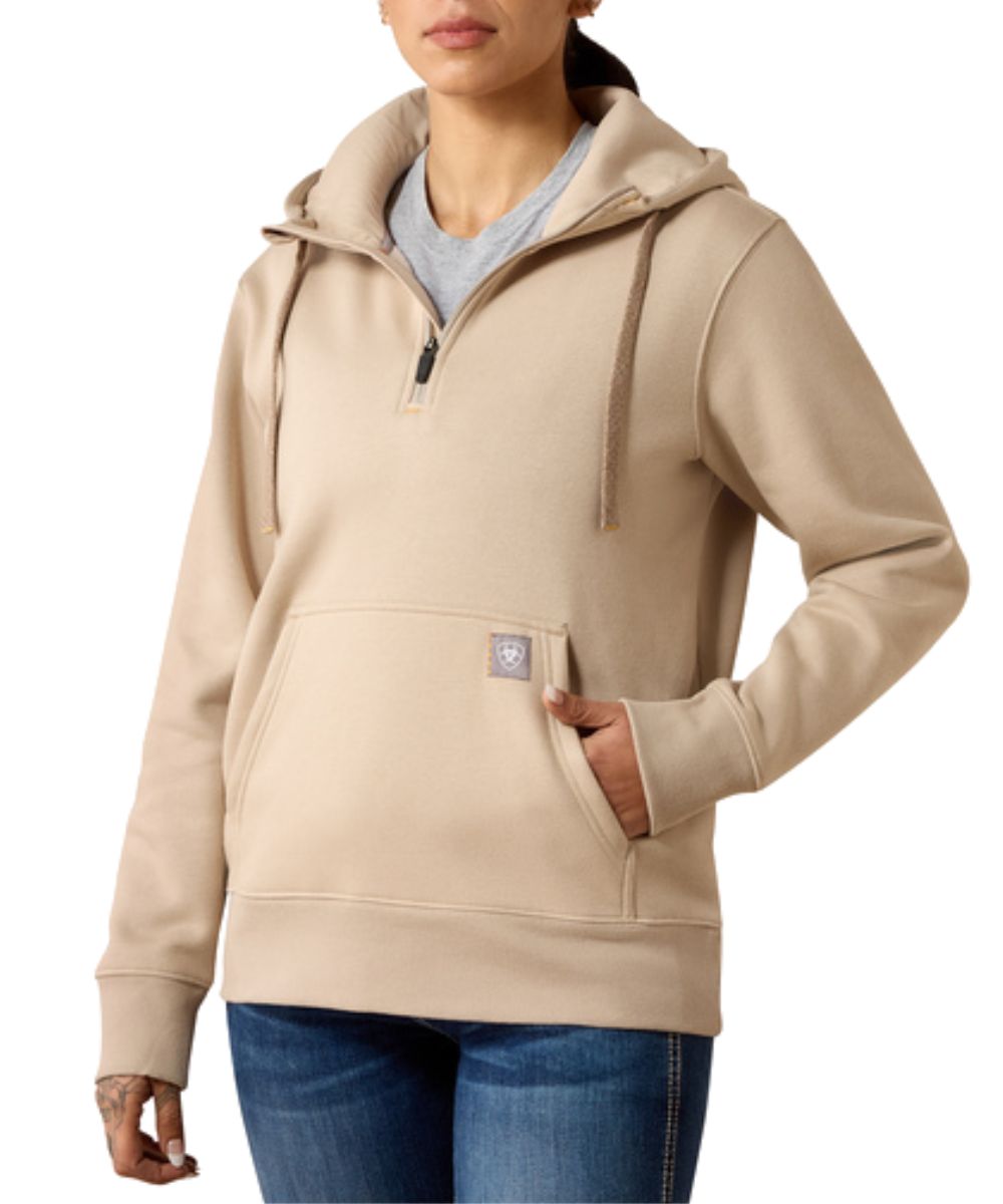 Front view of the women's String/Tan Ariat Rebar Skill Set 1/2 Zip Hoodie featuring the kangaroo pocket with a hidden media/phone pocket, and contrast hood drawstring