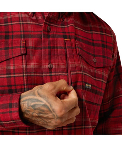 Close-up view of the plaid print and button-through flap chest pockets with a hidden pen slot featuring the zippered napoleon pocket at the left chest pocket
