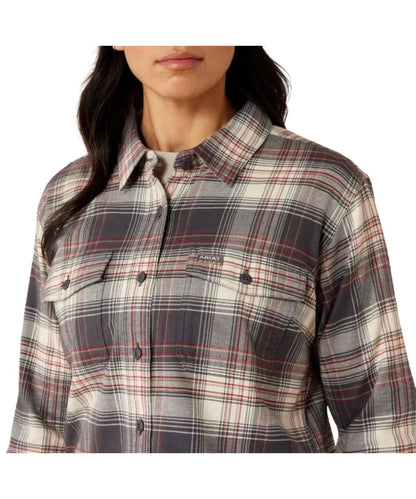 Close-up view of the women's long sleeve flannel work shirt featuring the chest pockets and grey and white plaid print