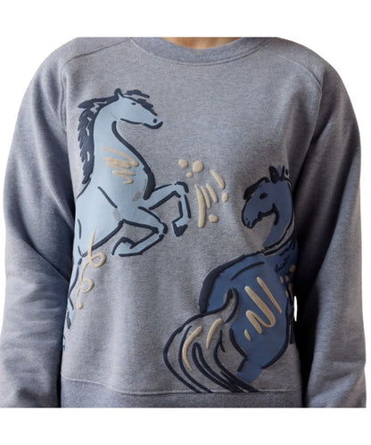 Close-up view of the playful puff screen-printed horse graphic on the girl's blue grey sweatshirt
