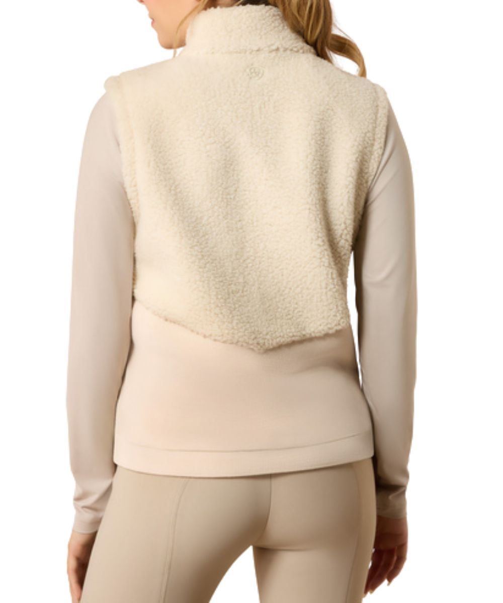 Back view of the girl's sleeveless cream vest featuring the sherpa fabric and mock collar