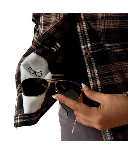 Close-up view of the slightly cropped hem featuring the hidden microfiber lens cloth for on-the-go cleaning