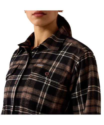 Close-up view of the women's black work shirt featuring the plaid print, spread collar, relaxed fit, and button-through flap chest pockets