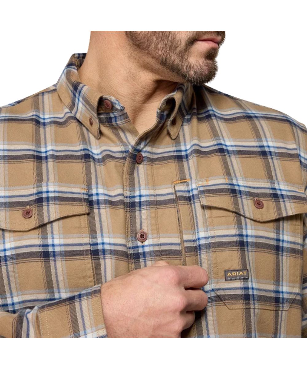 Close-up view of the men's long sleeve button down work shirt featuring the chest pockets with an additional napoleon pocket, button down collar, and pen slot