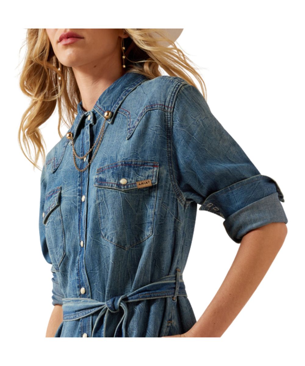 Close-Up View Of The Women's Denim Dress Featuring Snap Flap Chest Pockets And A Removable Waist Belt