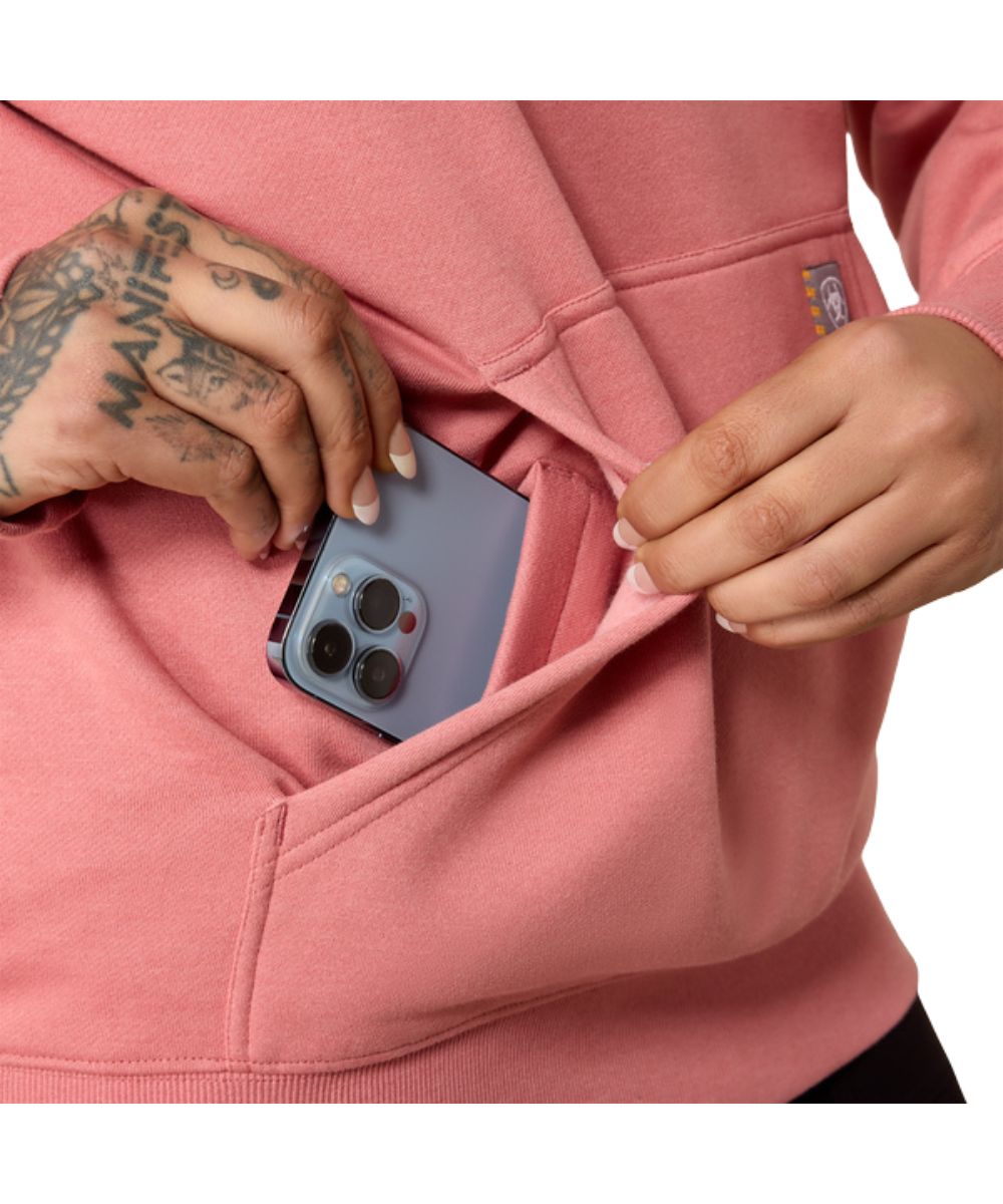 Close-up view of the kangaroo pocket featuring the hidden phone pocket