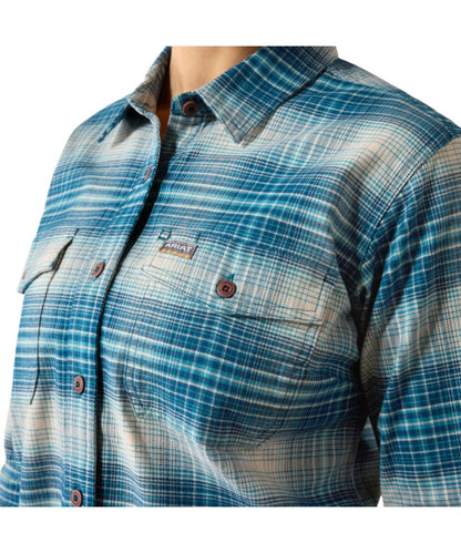 Close-up view of the women's blue and white flannel plaid long sleeve work shirt featuring the chest pockets with a hidden pen slot