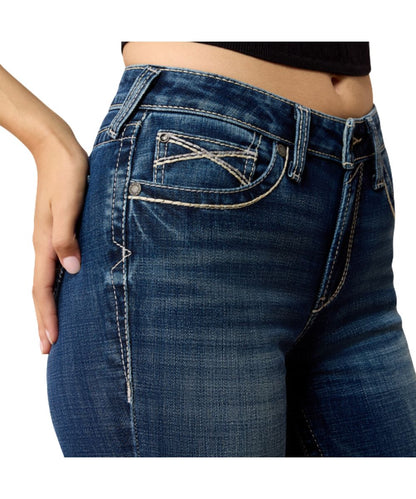 Close-up view of the front pocket, high rise, and slim fit on the medium wash women's trouser jean