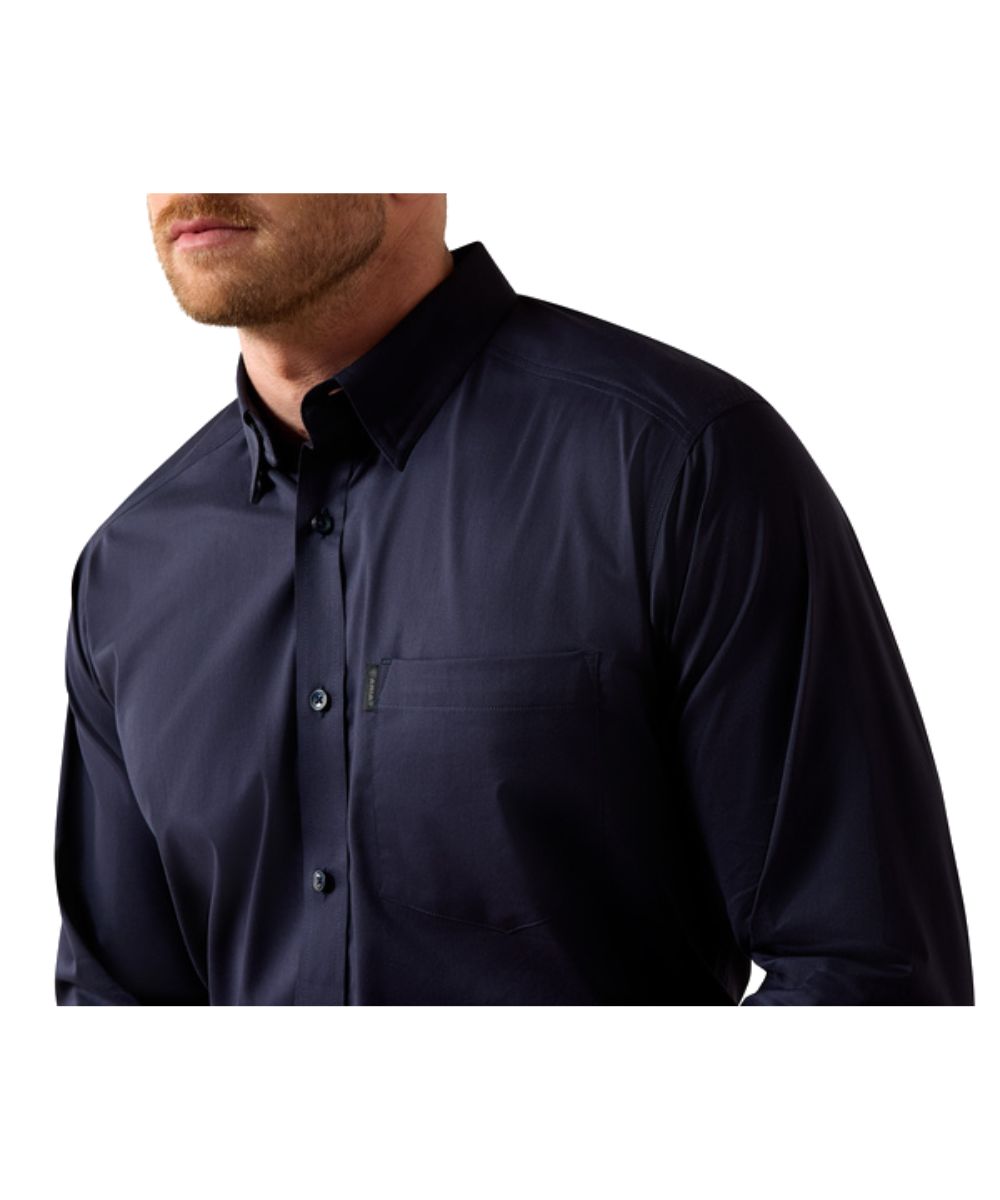 Close-up view of the navy solid print, hidden button down collar, and single open chest pocket with hidden pen slot