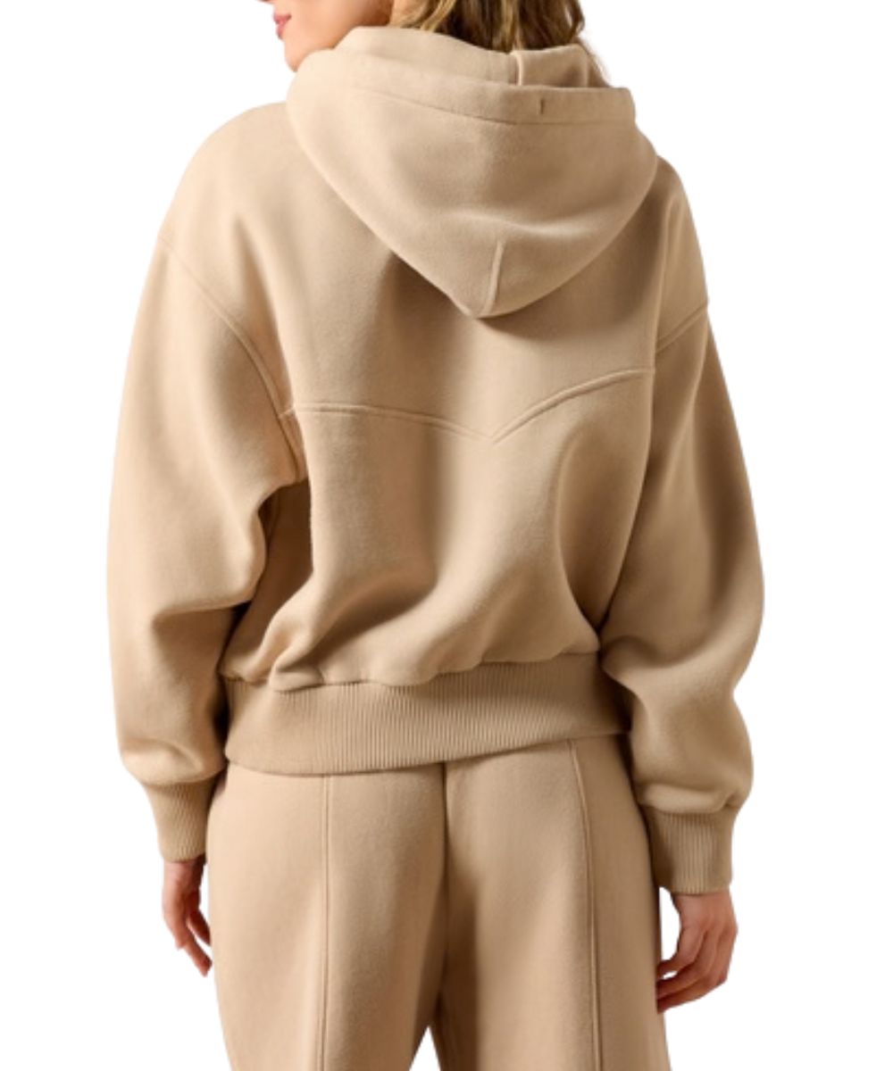 Back view of the women's long sleeve tan hoodie featuring the western seam yoke detailing