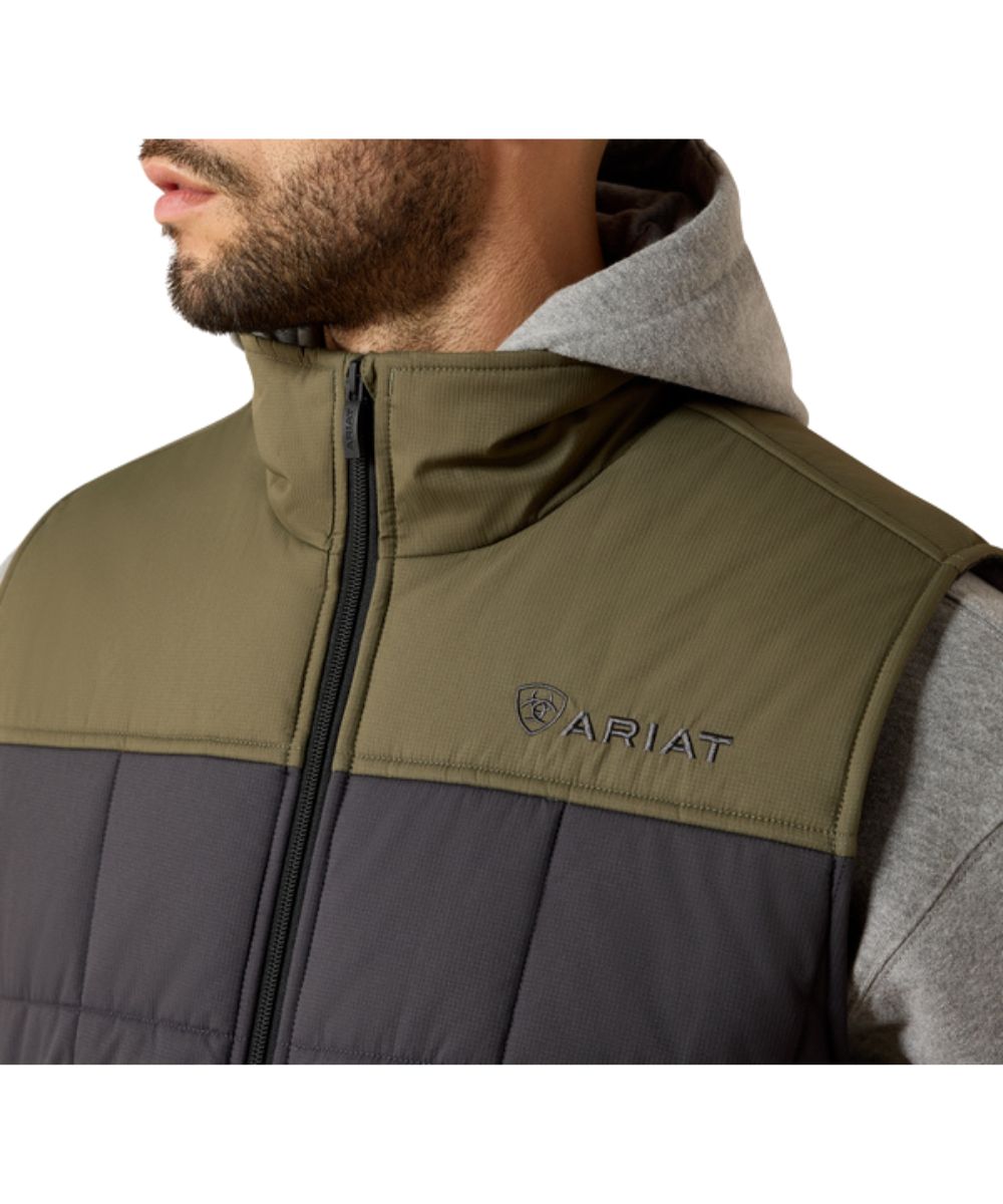 Close-up view featuring the mock collar, zipper closure, and logo embroidery