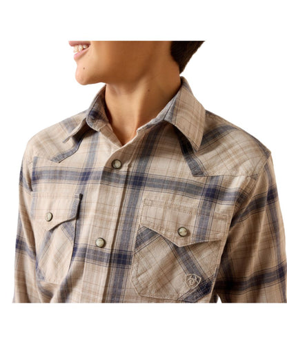 Close-up view of the peyote plaid print on the boy's long sleeve snap shirt featuring the classic fit, western yokes, and chest pockets
