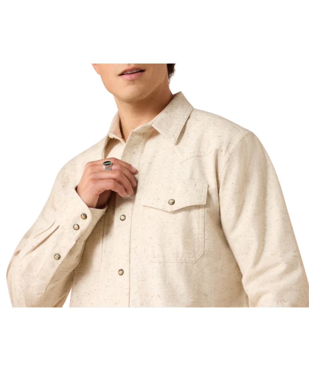 Close-up view of the men's peyote snap shirt featuring the snap flap chest pockets and single point western yokes