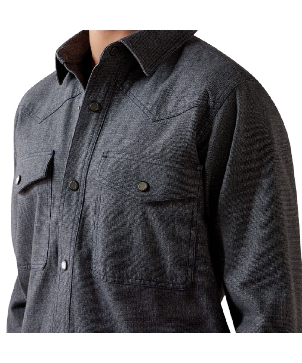Close-up view of the men's shirt jacket featuring the single point western yokes, spread collar, and single point snap flap chest pockets