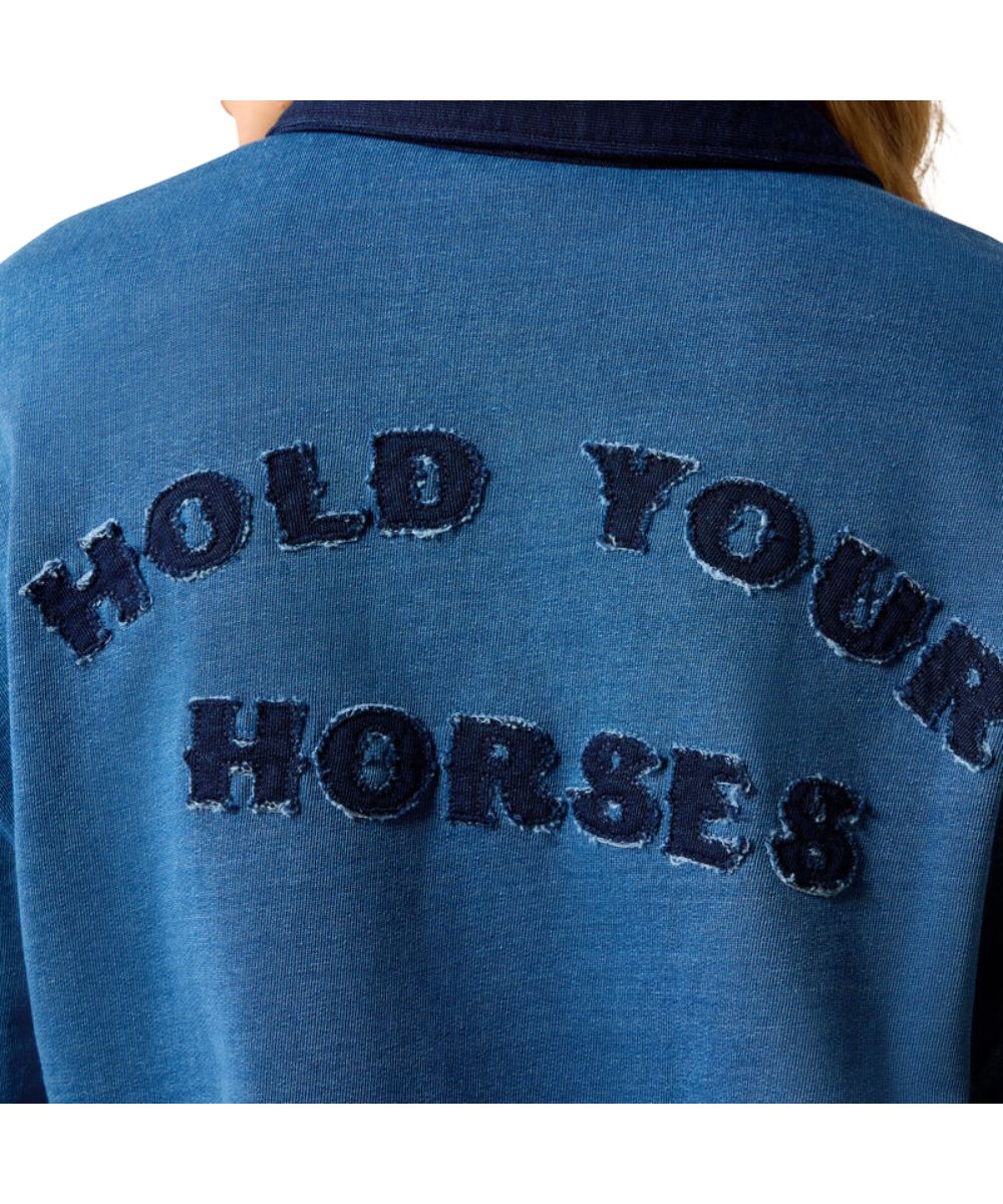 Close-up of the back of a blue sweatshirt with dark navy embroidered text reading 'HOLD YOUR HORSES' on a white background.