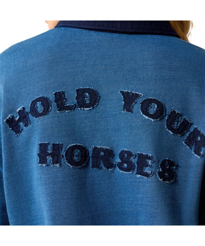 Close-up of the back of a blue sweatshirt with dark navy embroidered text reading 'HOLD YOUR HORSES' on a white background.