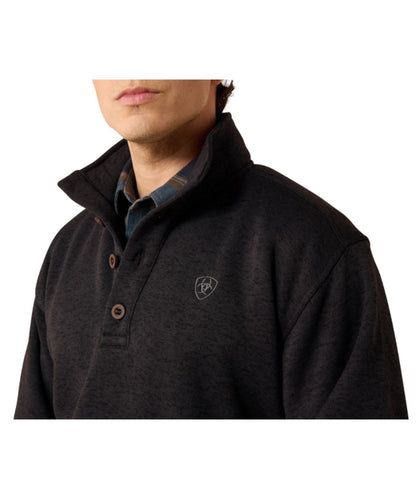 Close-up view of the men's phantom sweater featuring the faux horn 4-button 1/4 button closure and logo embroidery on the chest 