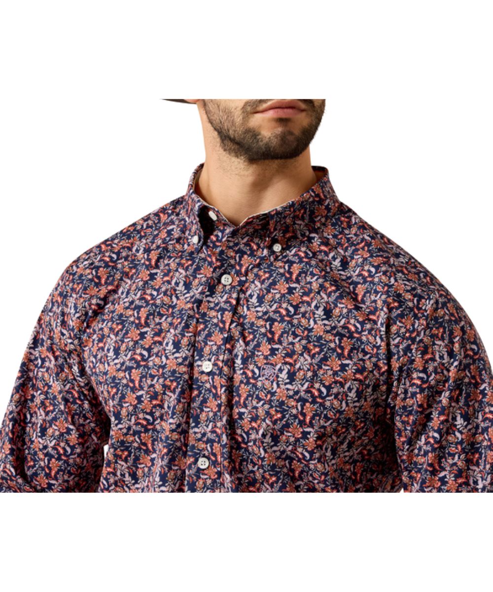 Close-up view of the maritime blue vine print, chest pocket, white buttons, and button down collar