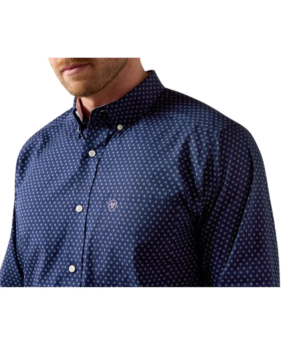 Close-up view of the geometric print, button down collar, and chest pocket