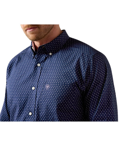 Close-up view of the geometric print, button down collar, and chest pocket