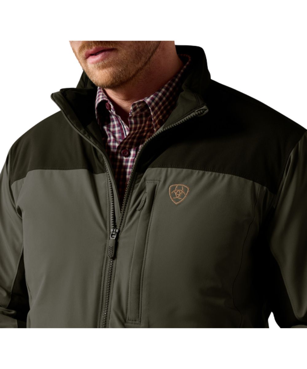 Close-up view of the color blocked design on the men's forest night jacket featuring the zippered chest pocket