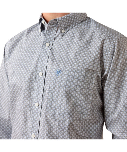 Close-up view of the light blue geometric print and single open chest pocket with a hidden pen slot