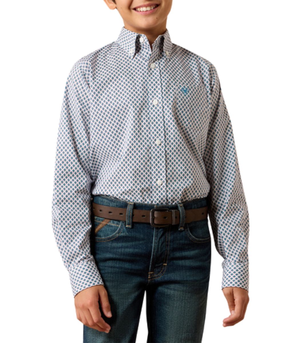 Front view of the boy's Ariat Perez Classic Fit Button Down Shirt in white featuring the blue geometric print, button down collar, open chest pocket, and extra-long hem