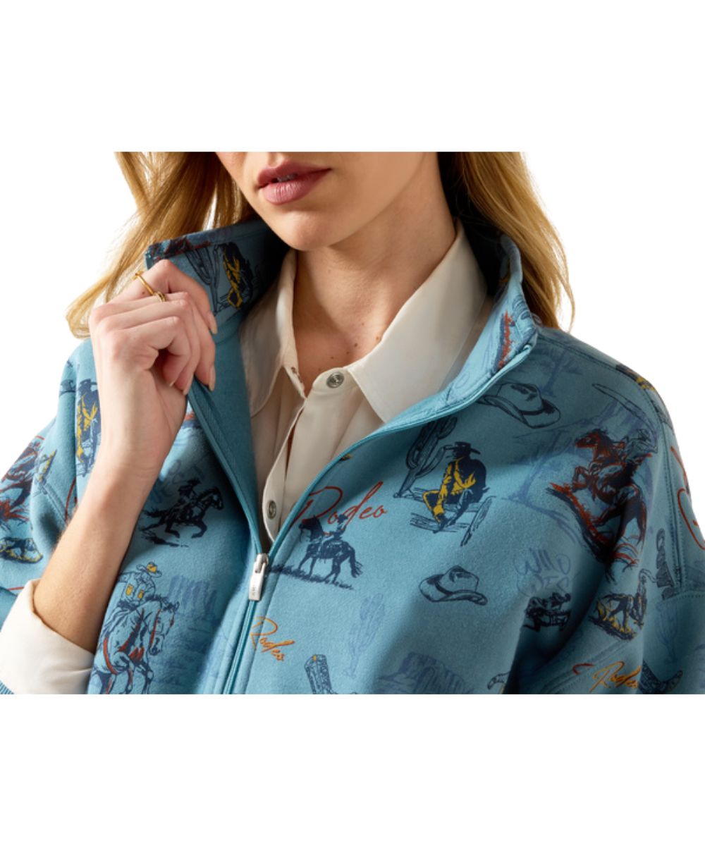 Close-up view of the mock collar, 1/2 zip closure, and retro rodeo print