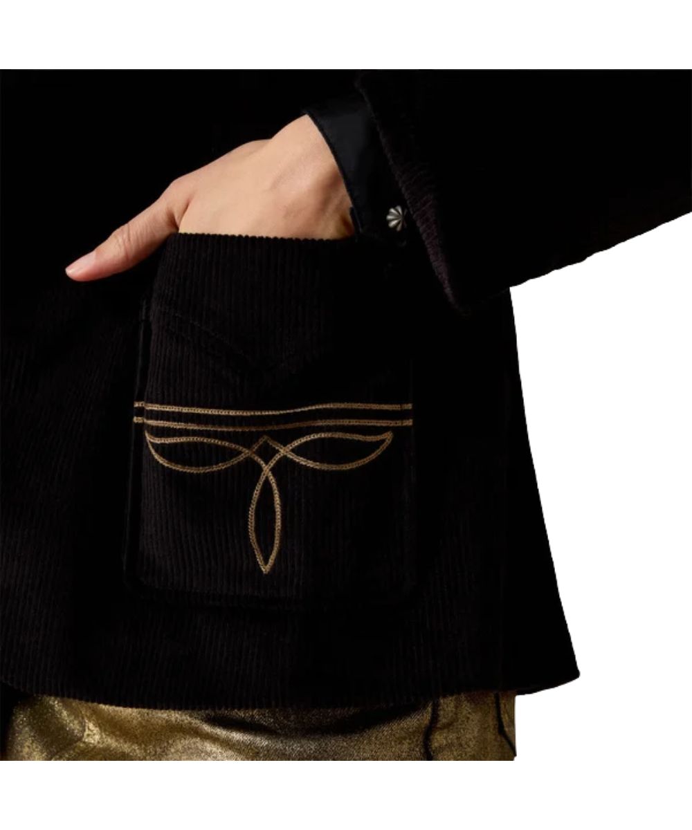 Close-up view of the open hand pockets featuring the gold-toned western embroidery