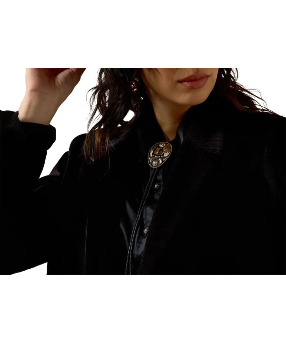 Close-up view of the corduroy fabric and the notched lapel collar