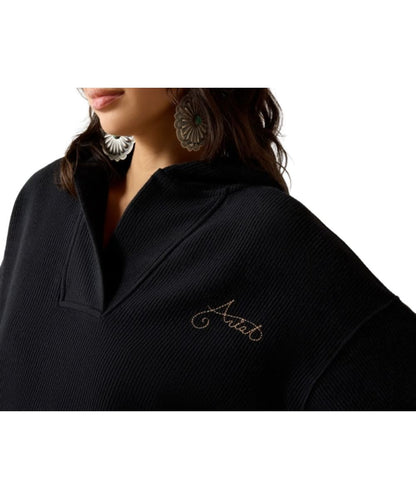 Close-up view of the soft terrycloth slouchy sweatshirt featuring the logo embroidery at the left chest