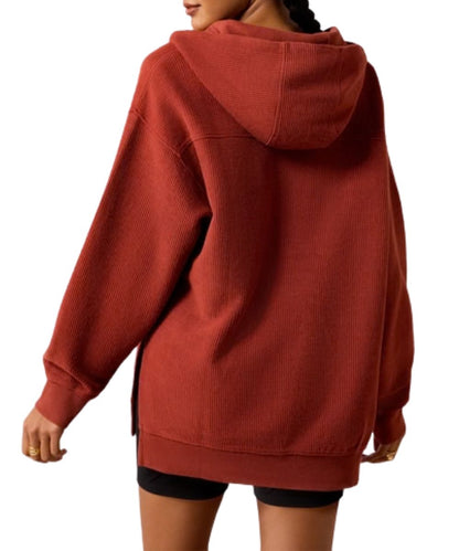 Back view of the women's burnt henna hoodie featuring the straight back yoke and side slits