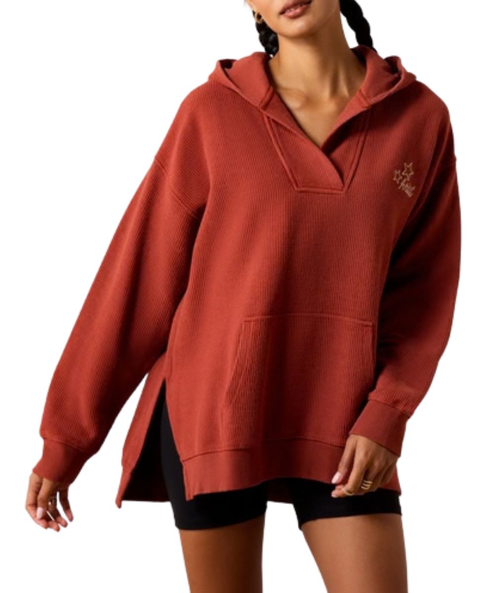 Front view of the women's burnt henna Ariat Valencia Hoodie featuring the effortless fit, long sleeves, hooded collar, v-neckline, kangaroo pocket, and side slits