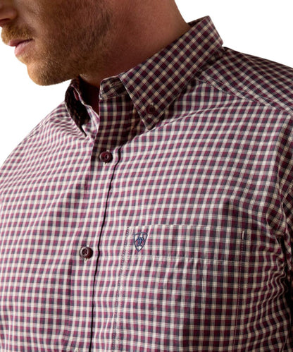 Close-up view of the burgundy and blue mircro plaid print, chest pocket, and button down collar