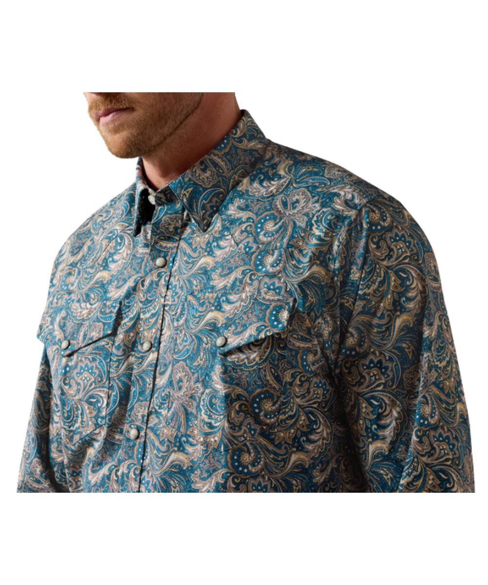 Close-up view of the multicolor paisley print on the men's blue long sleeve shirt featuring the snap flap chest pockets with a hidden pen slot and western yokes