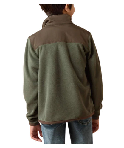 A child viewed from the back wearing a fleece pullover jacket with an olive green body and brown shoulder yoke, paired with blue jeans against a plain white background.