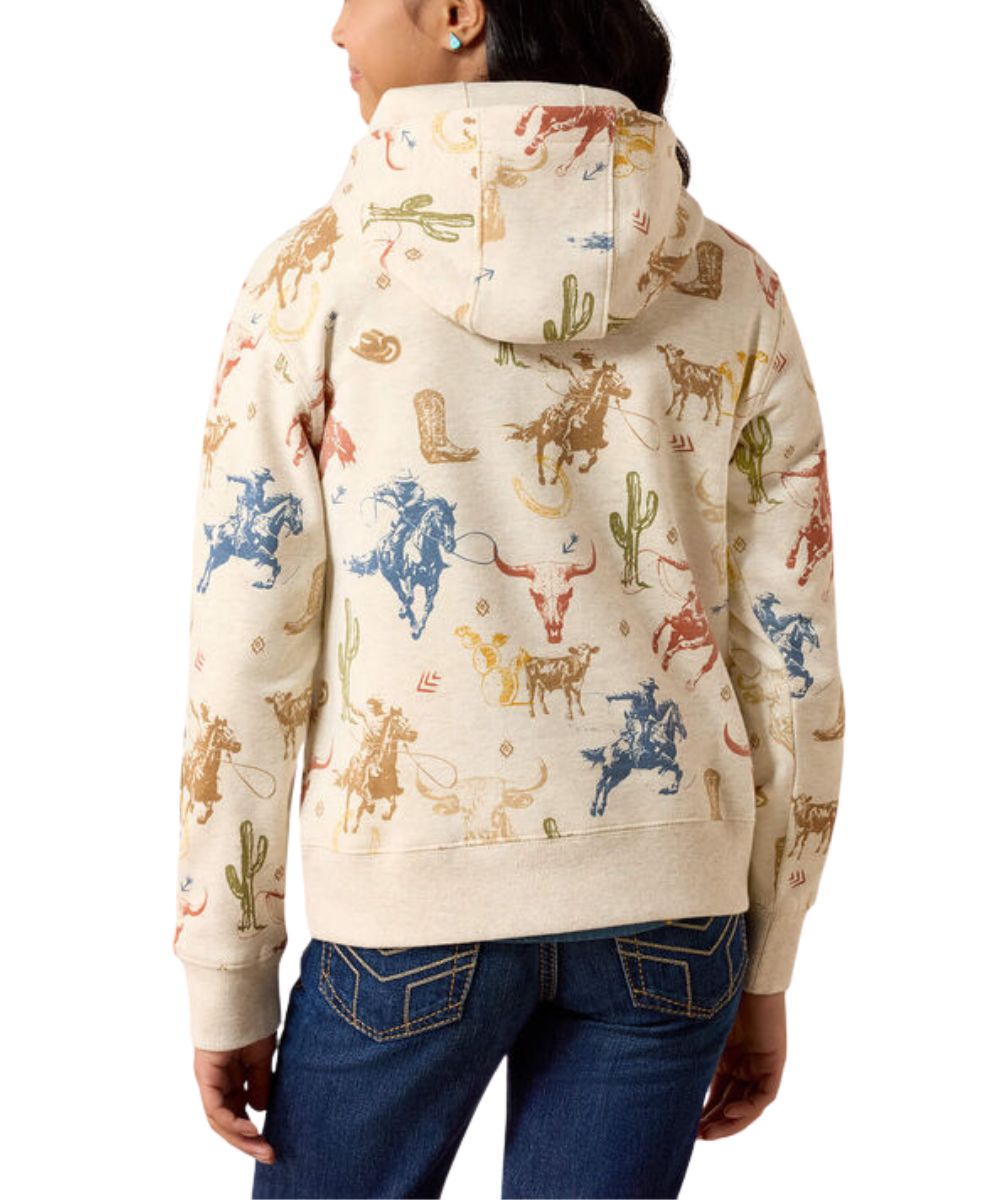 A person shown from the back wearing a cream-colored hooded sweatshirt with a colorful western-themed print of cowboy boots, cacti, and rodeo animals, paired with blue jeans against a white background.