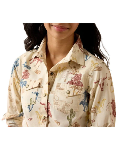 Close-up view of the girl's long sleeve pearl snap shirt featuring the western yokes on the front, and the single point snap flap chest pockets