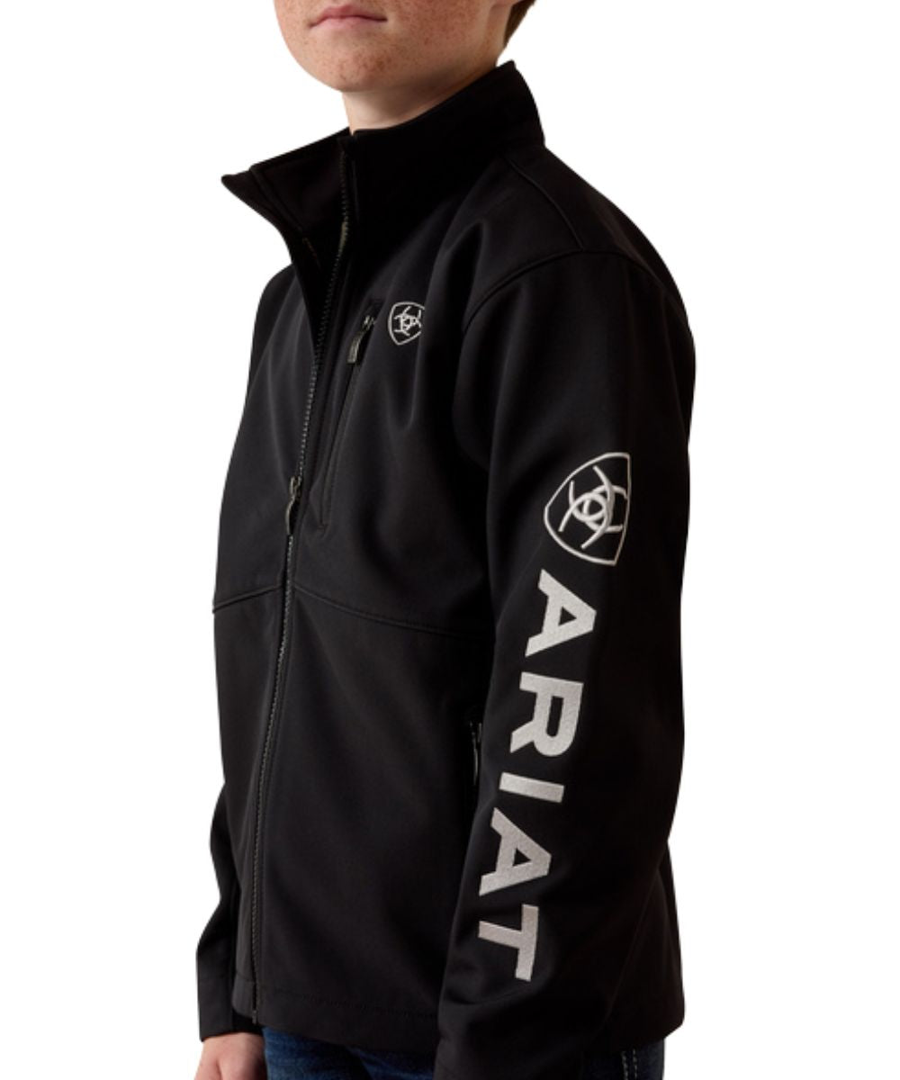 Side view of the boy's black long sleeve softshell jacket featuring the lightweight warmth and logo embroidery down the sleeve