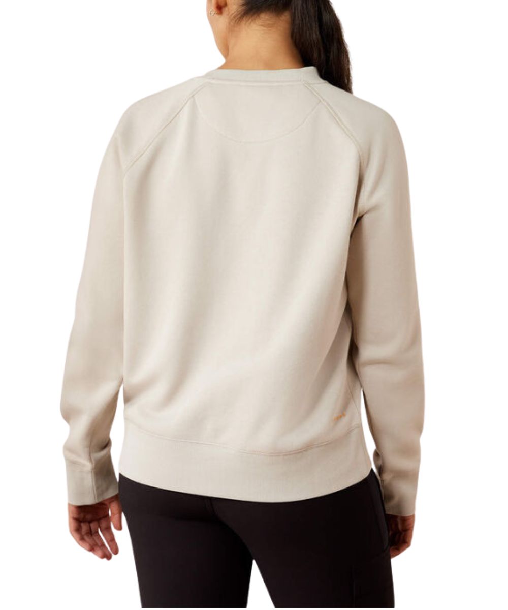 A woman shown from the back wearing a light beige crewneck sweatshirt and black leggings against a plain white background.