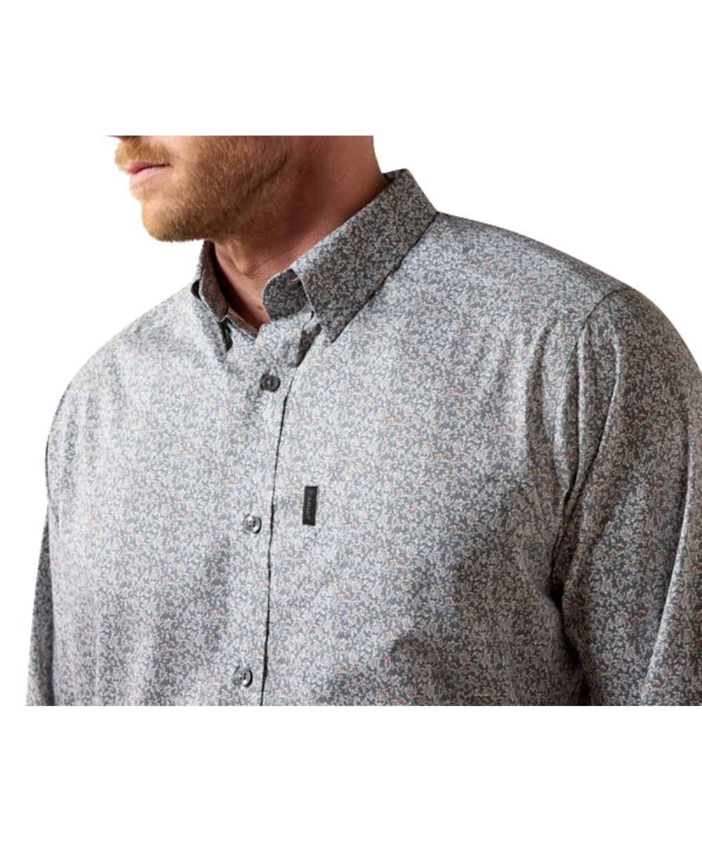 Close-up view of the grey vine printed men's long sleeve button down featuring the single open chest pocket with a hidden pen slot
